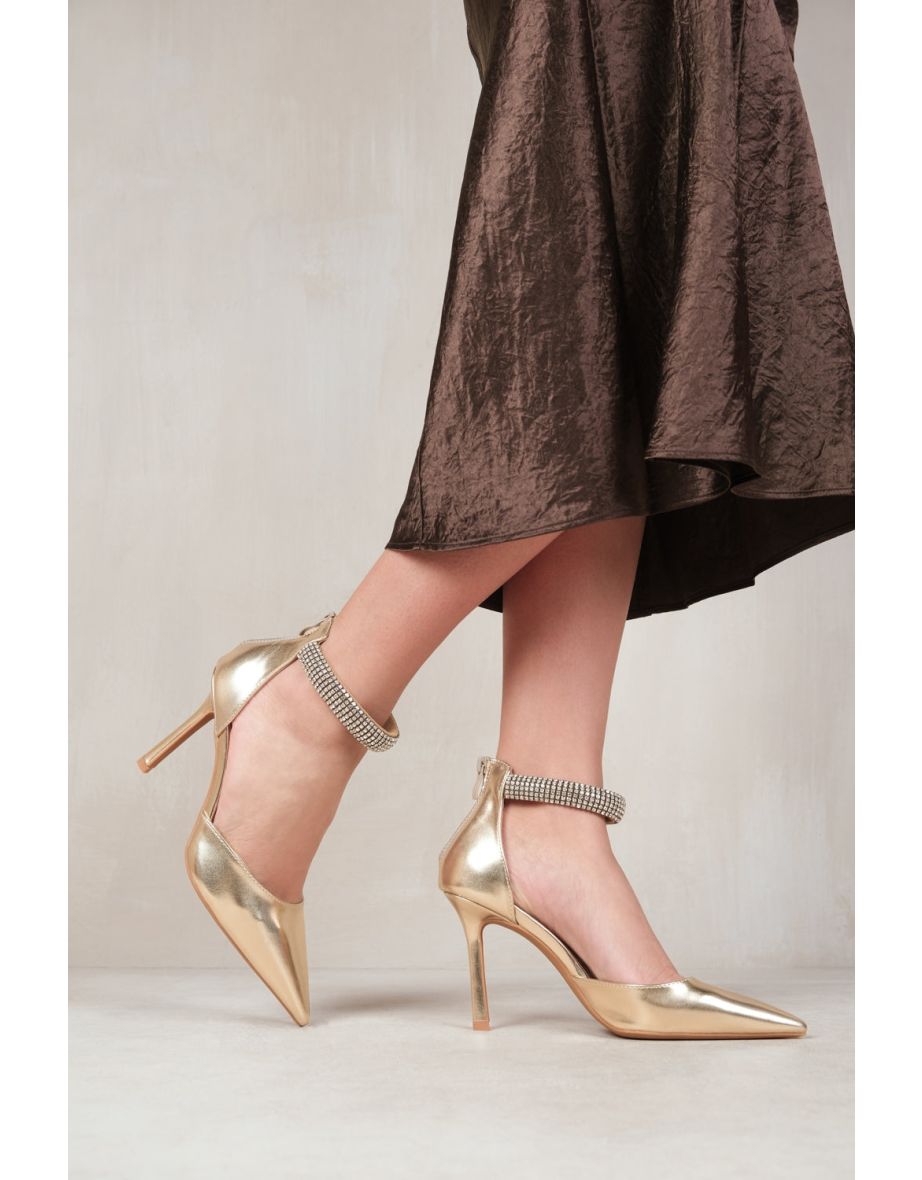 SAPPHIRE POINTED TOE HIGH HEELS WITH DIAMANTE DETAIL ANKLE STRAP IN gold-metallic