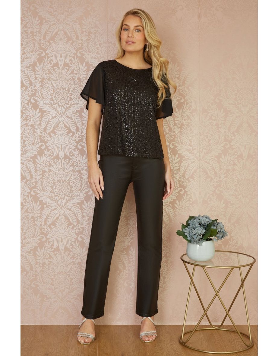 Yumi Black Sequin Top With Sheer Sleeves And Cut Out Back