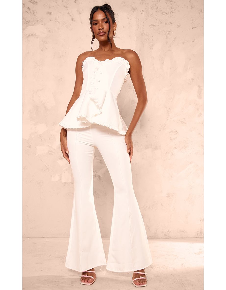 Shop White Woven Frill Peplum Flared Jumpsuit Online in Saudi Arabia VogaCloset