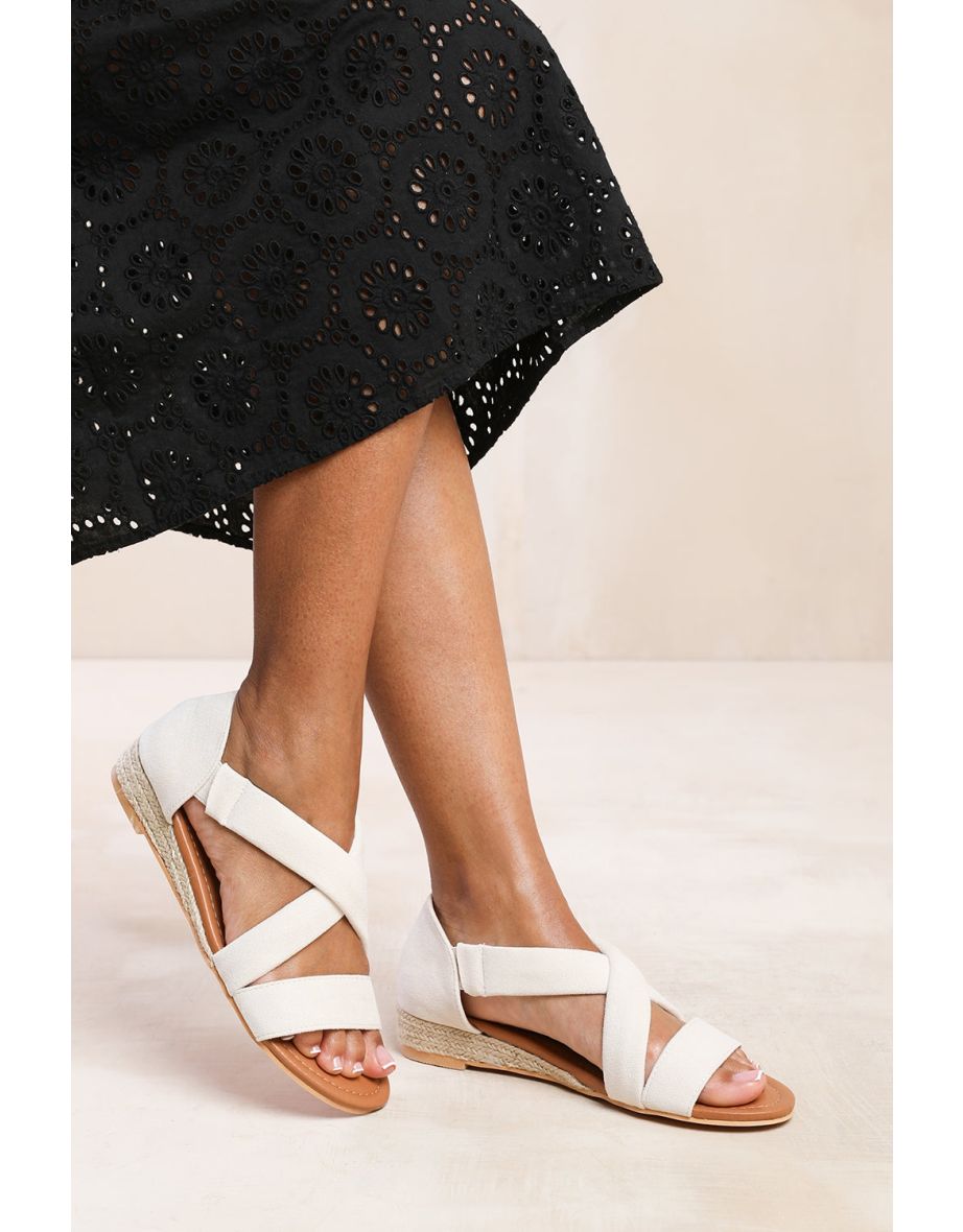 HUMMINGBIRD LOW WEDGE SHOES WITH CROSS OVER STRAP IN LIGHT CREAM SUEDE