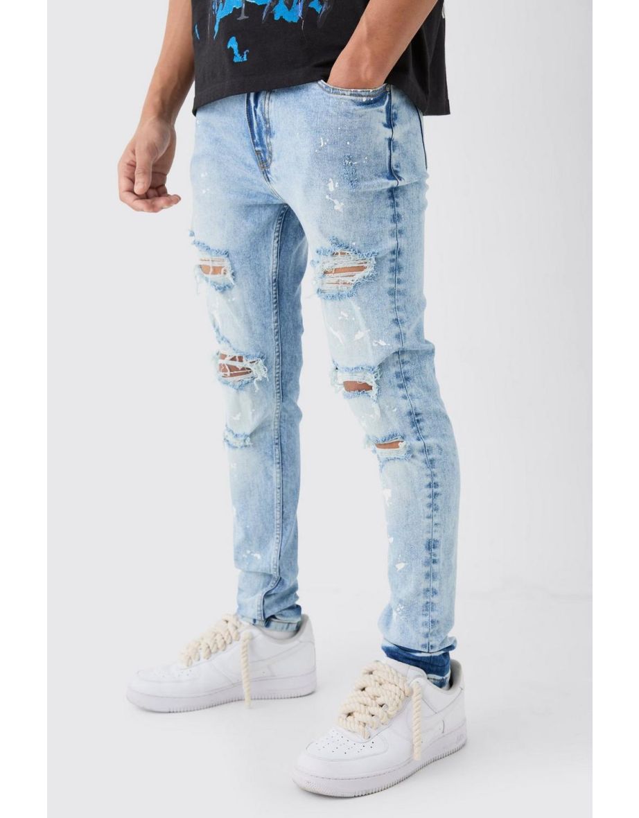 Ripped jeans with paint splatter top