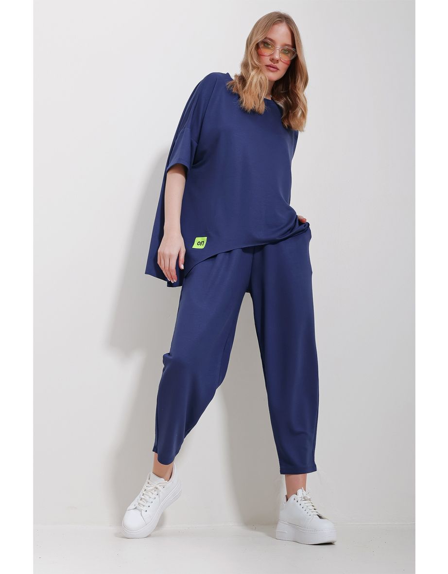 Women's Indigo Crew Neck Asymmetric Cut Coated Blouse And Trousers Suit
