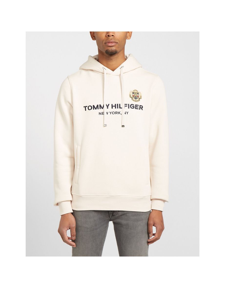 Shop Men s Tommy Hilfiger Stacked Central Logo Hoodie in Cream Online in Qatar VogaCloset