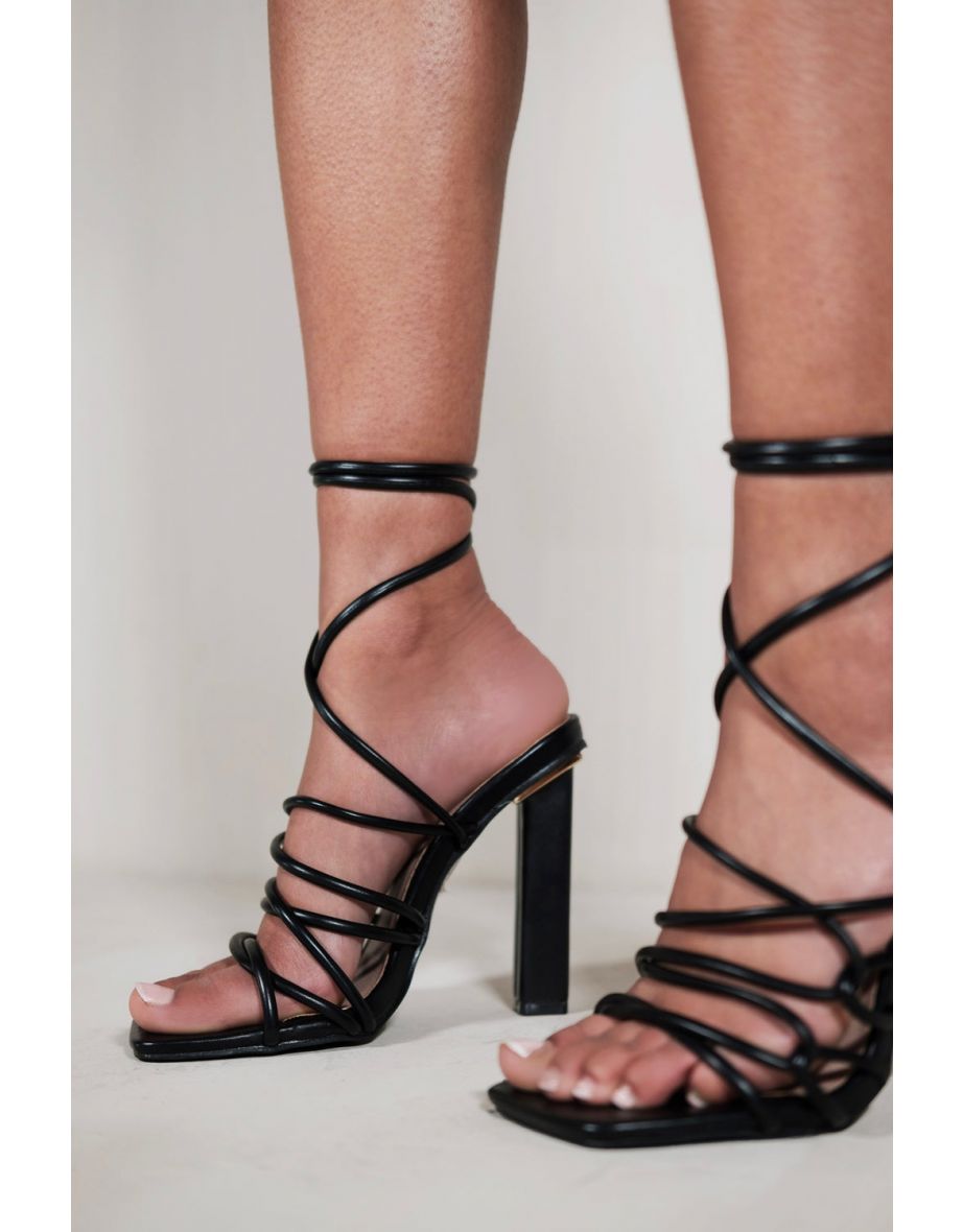 HIGH HEELS WITH A TIE LEG AND CROSS OVER STRAP DETAIL IN BLACK FAUX LEATHER - 1