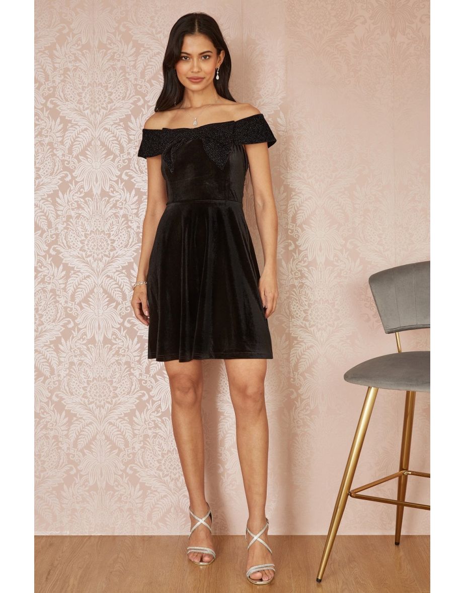 Shop Mela Black Velvet Skater Dress With Sparkle Bow Neckline Online in Bahrain VogaCloset