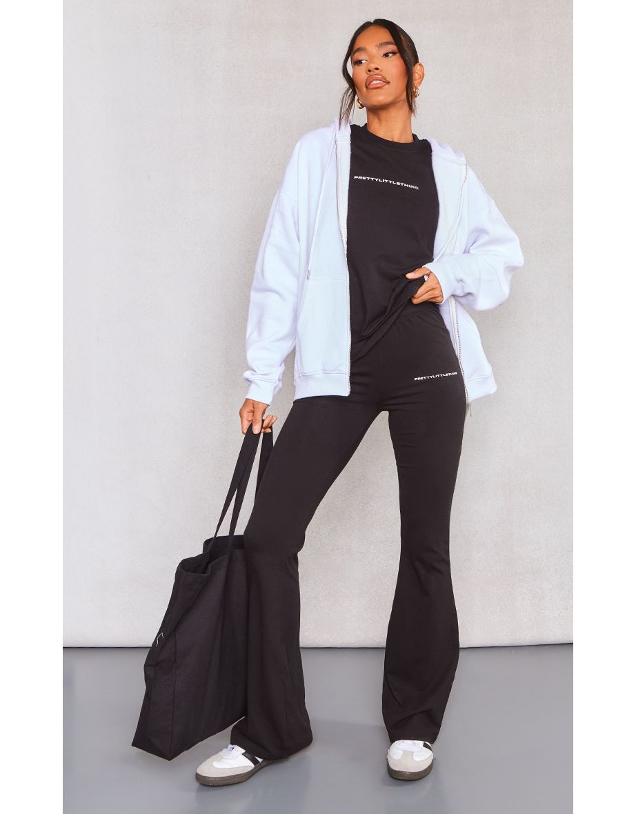 PRETTYLITTLETHING Black Printed Flared Trousers