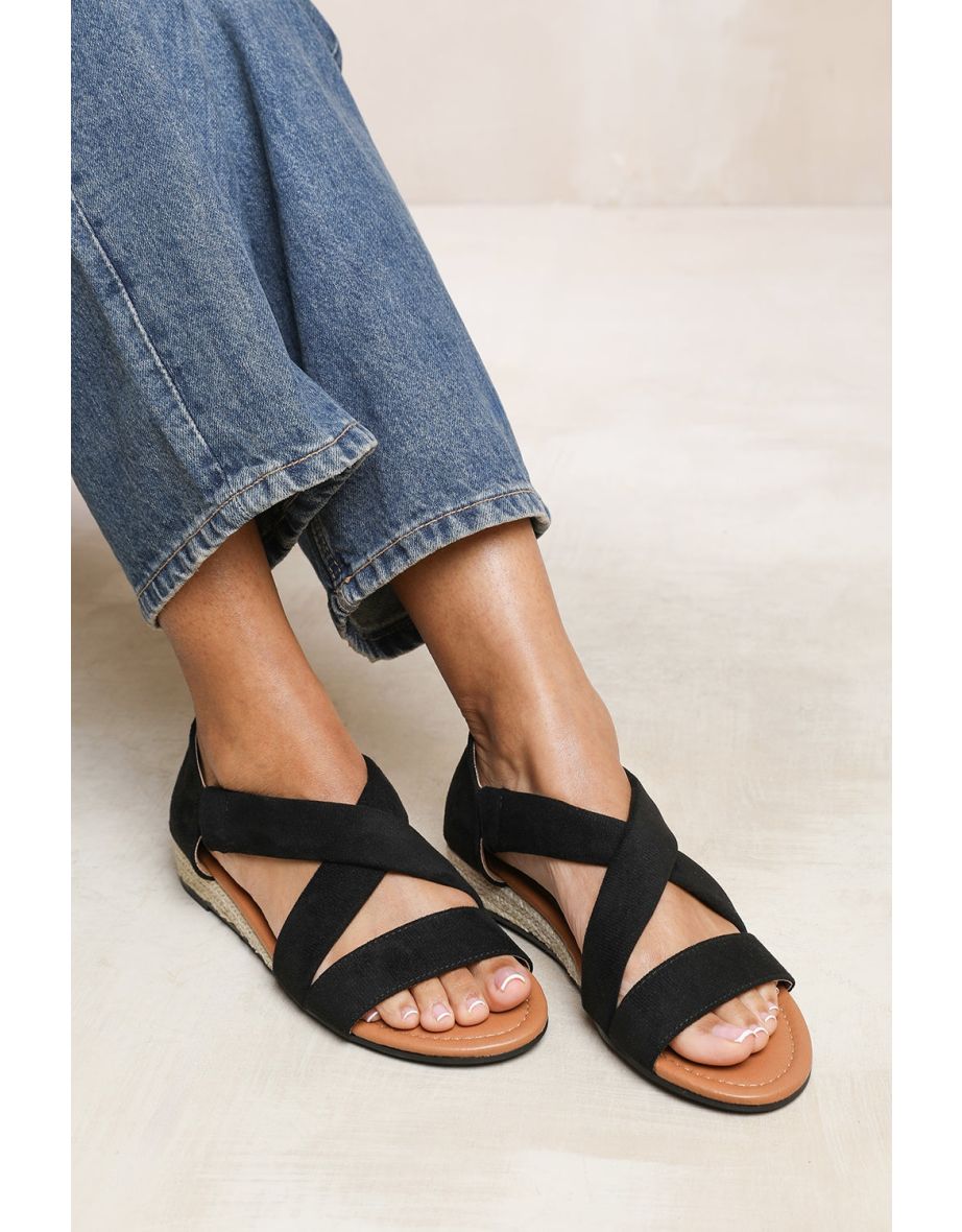 HUMMINGBIRD WIDE FIT LOW WEDGE SHOES WITH CROSS OVER STRAP IN BLACK SUEDE