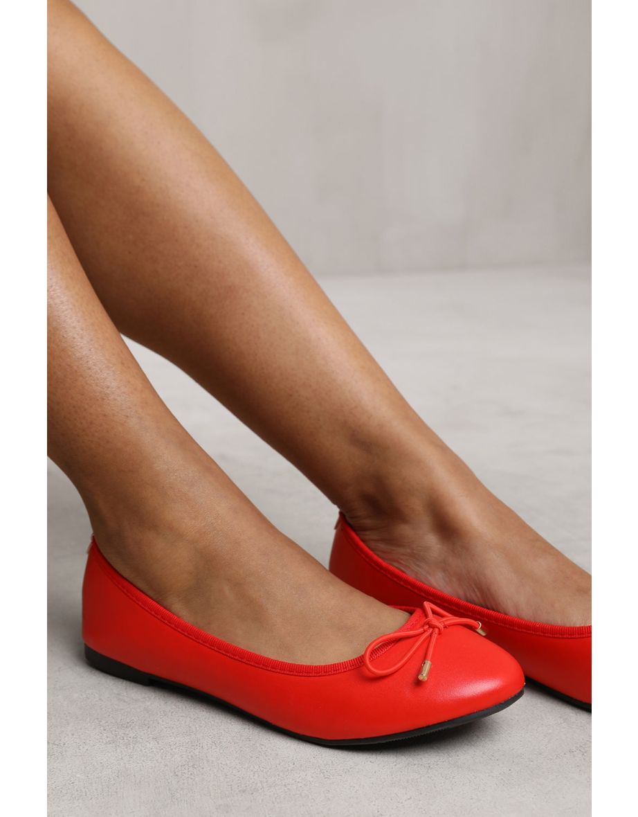RIDA SLIP ON FLAT PUMPS IN RED FAUX LEATHER