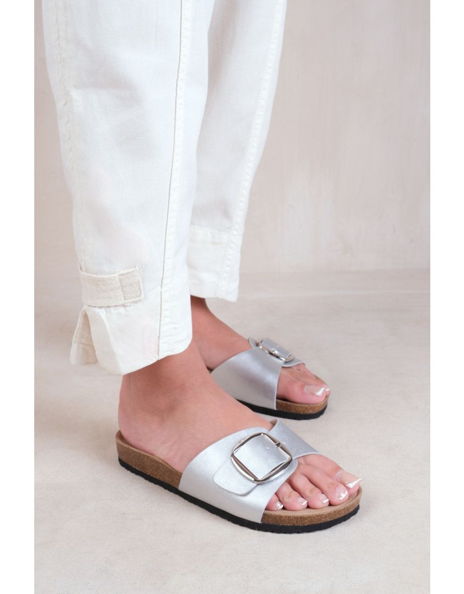 Shop SEQUOIA FLAT SINGLE STRAP SANDALS WITH BUCKLE DETAIL IN SILVER MATT FAUX LEATHER Online in Oman VogaCloset