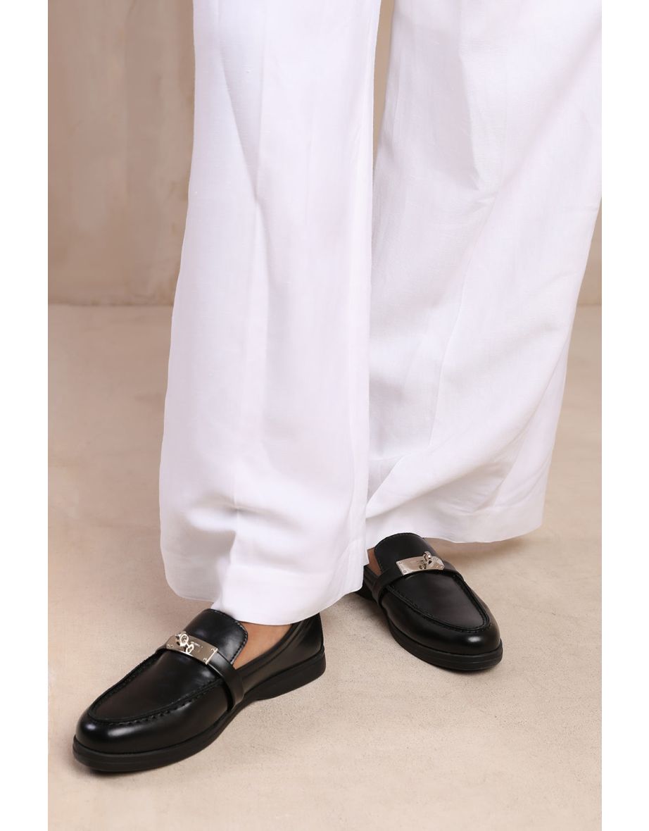 MONACO SLIP ON LOAFERS WITH METAL DETAILING IN BLACK FAUX LEATHER