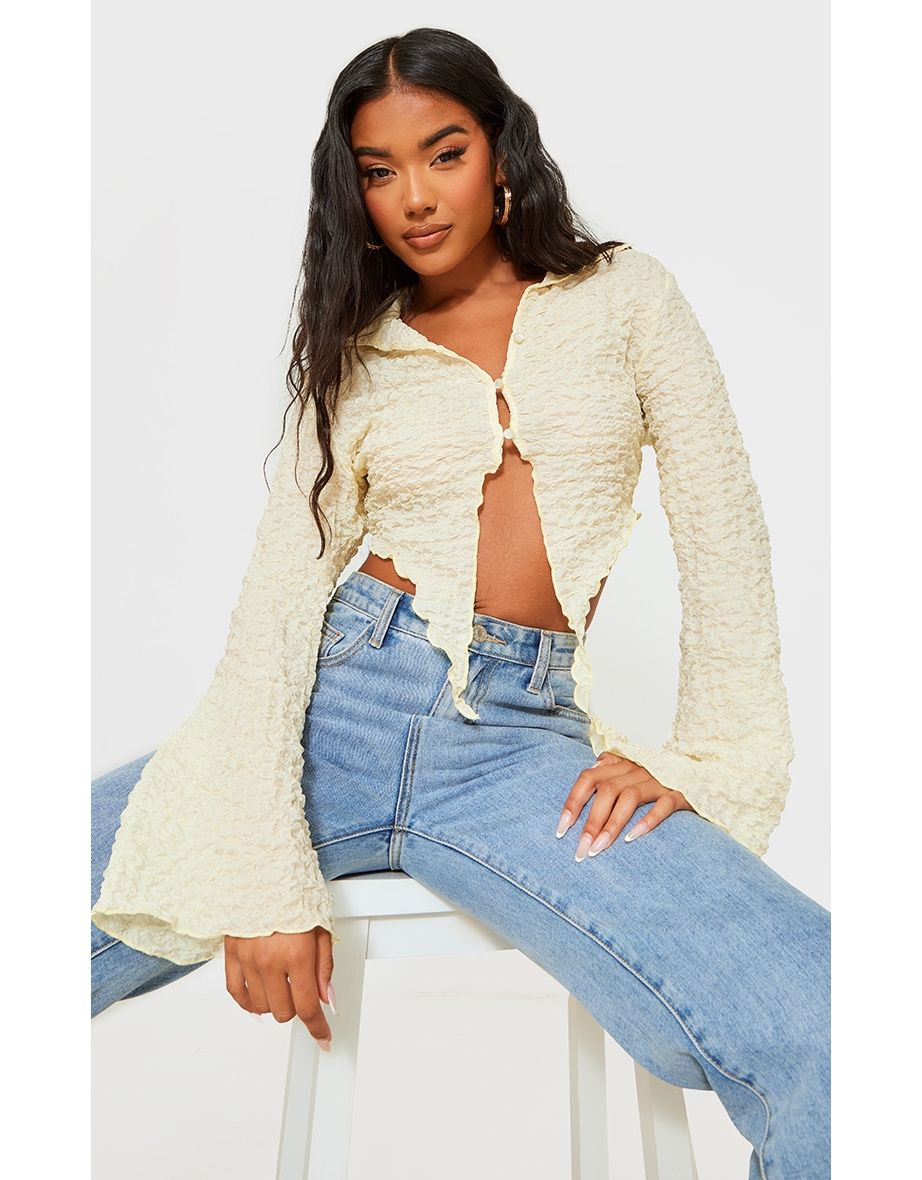 Cream Textured Dip Hem Flute Sleeve Shirt